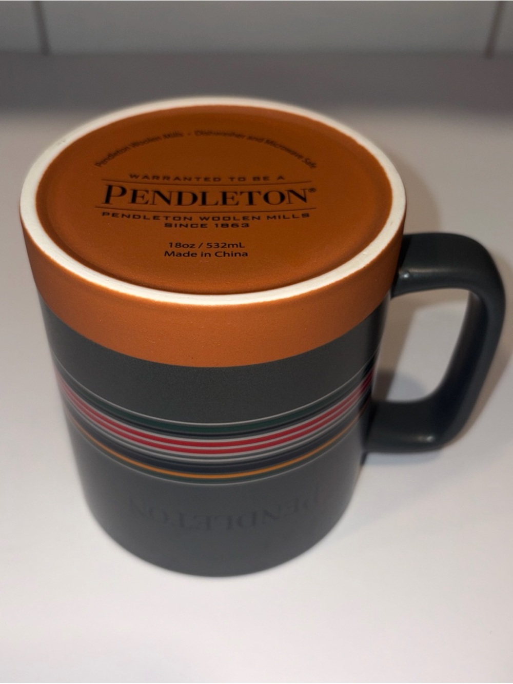 Pendleton Gray Mug with Orange Rim and Multi-Stripe Detail